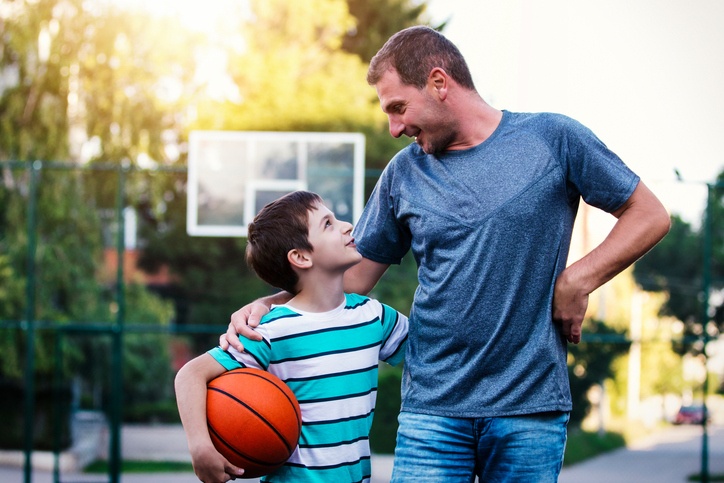 Family Playing Basketball After Loan Approval from Mortgage Broker