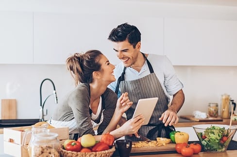 Couple Researching Best Loan Offers from Mortgage Companies